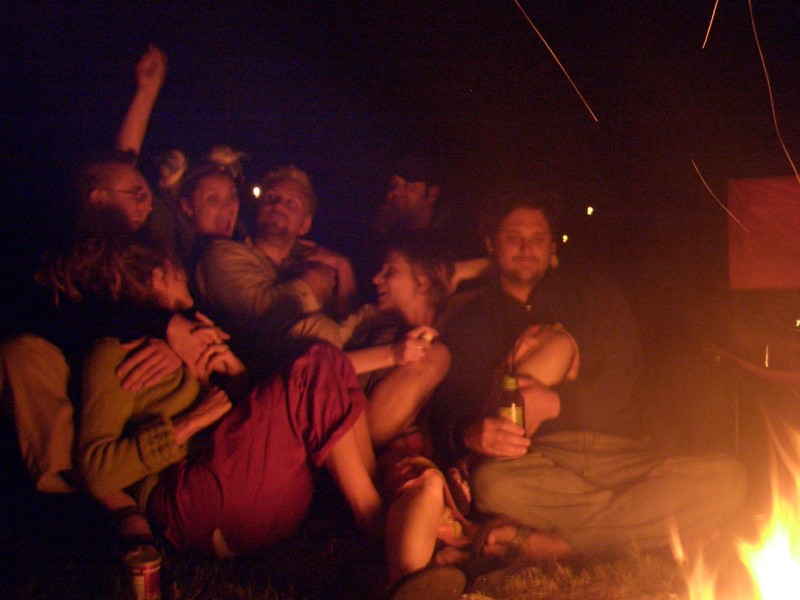 Guests hanging out around the campfire at my wedding, hour 30 of 48. Photo by Megan Hill of Hello Super Studios.