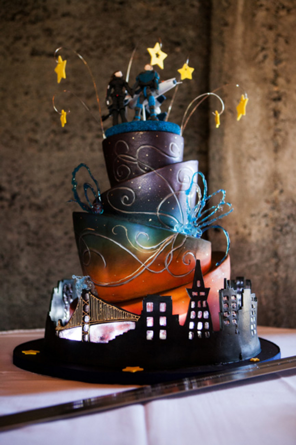 nerdy wedding cake - A costume wedding with winged shoes, fist bumps, and an Indiana Jones groom nerdy wedding cake