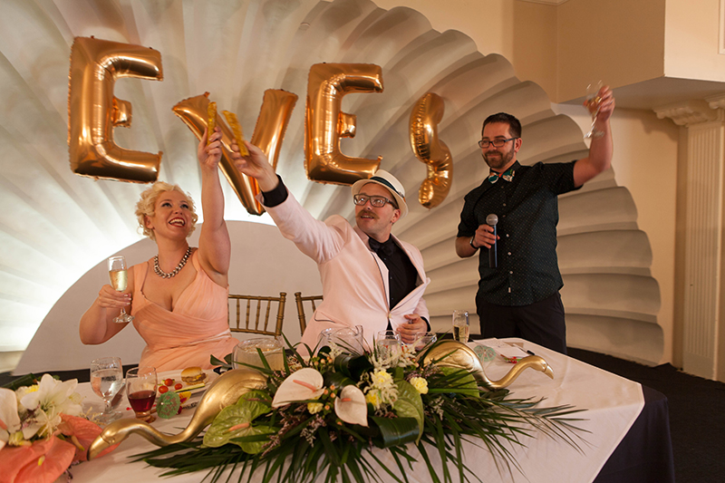 Flamingo-themed pool party wedding as seen on @offbeatbride