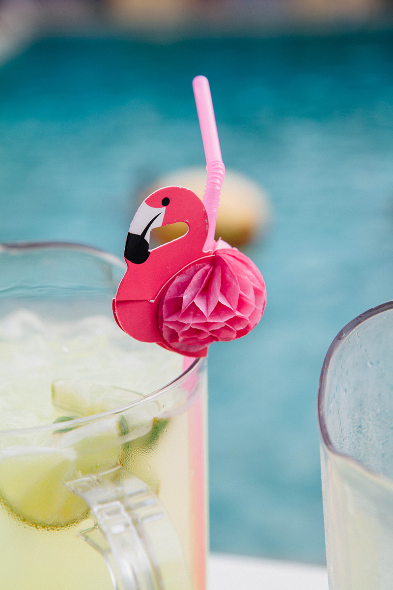 Flamingo-themed pool party wedding as seen on @offbeatbride