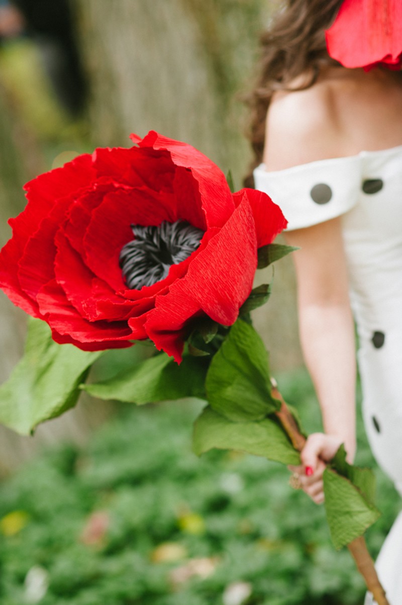 Huge red flowers + backyard wedding as seen on @offbeatbride #fascinator #hugeflowerbouquet