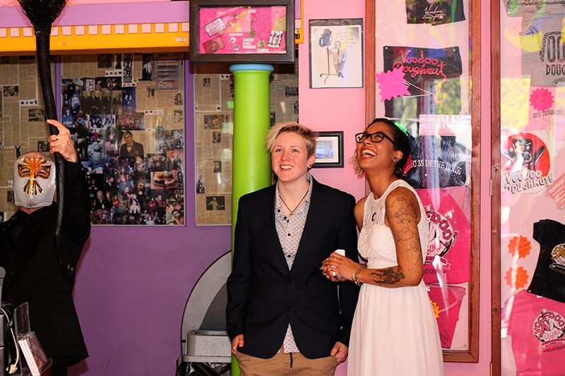 Ring Pops, donuts, and ladies in love at this Voodoo Donuts wedding