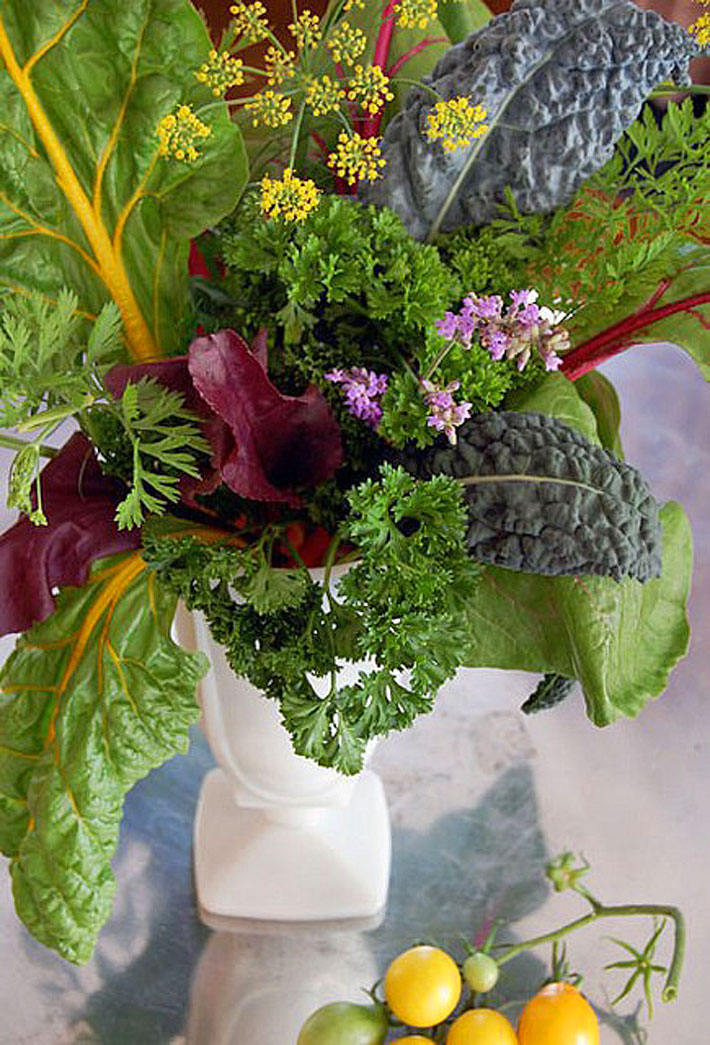 I love this vegetable centerpiece from The Art of Doing Stuff with beet greens, swiss chard, anise flowers, lavender, parsley, carrot tops, and of course, kale.