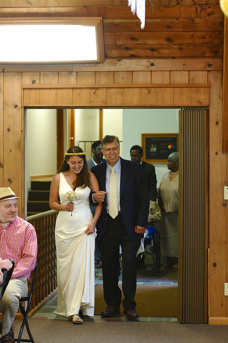 Overalls, a choreographed first dance, and custom popcorn at this wedding