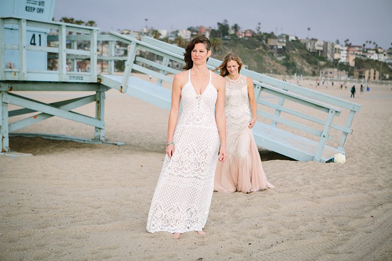 An aerial silk chuppah and two stunning gowns at this sweet beach wedding