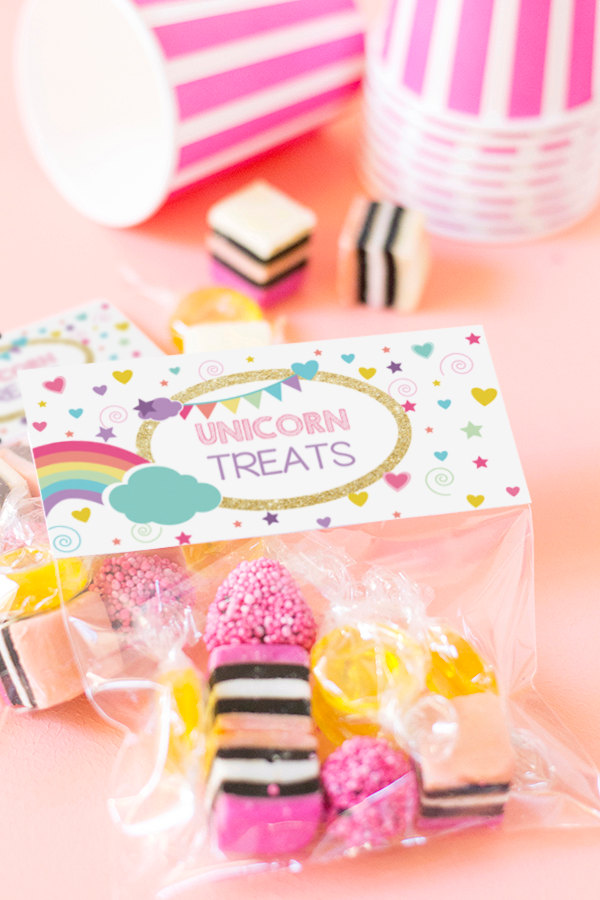 Or print your own "unicorn treats" bag toppers from Etsy seller SunshineParties and "treat" your guests with your favorite candies.