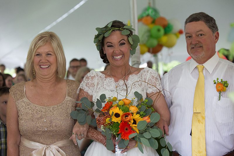 Rain falls like love at this "mutual weirdness" bright colored wedding
