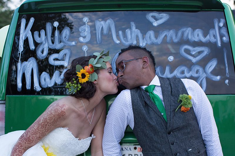 Rain falls like love at this "mutual weirdness" bright colored wedding