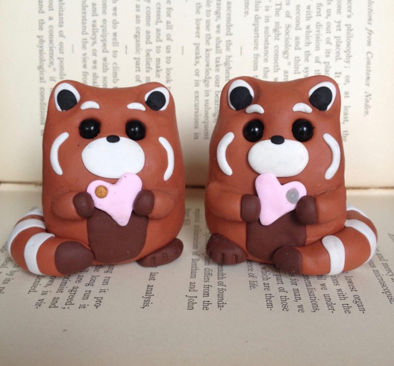 Adorable red panda cake topper