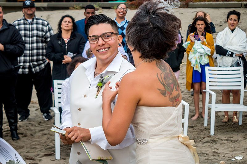 Two ladies rocked their rainy beach wedding