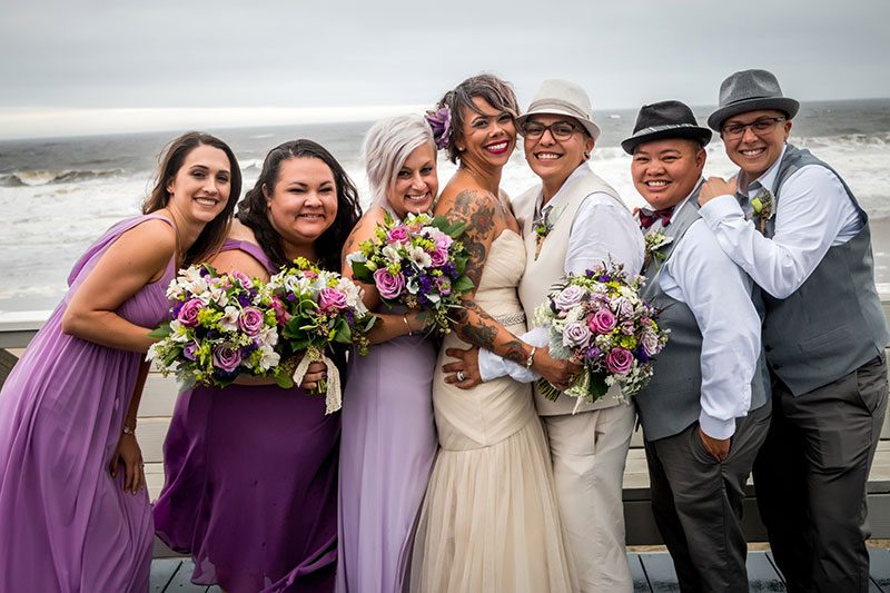 Two ladies rocked their rainy and stunning beach wedding