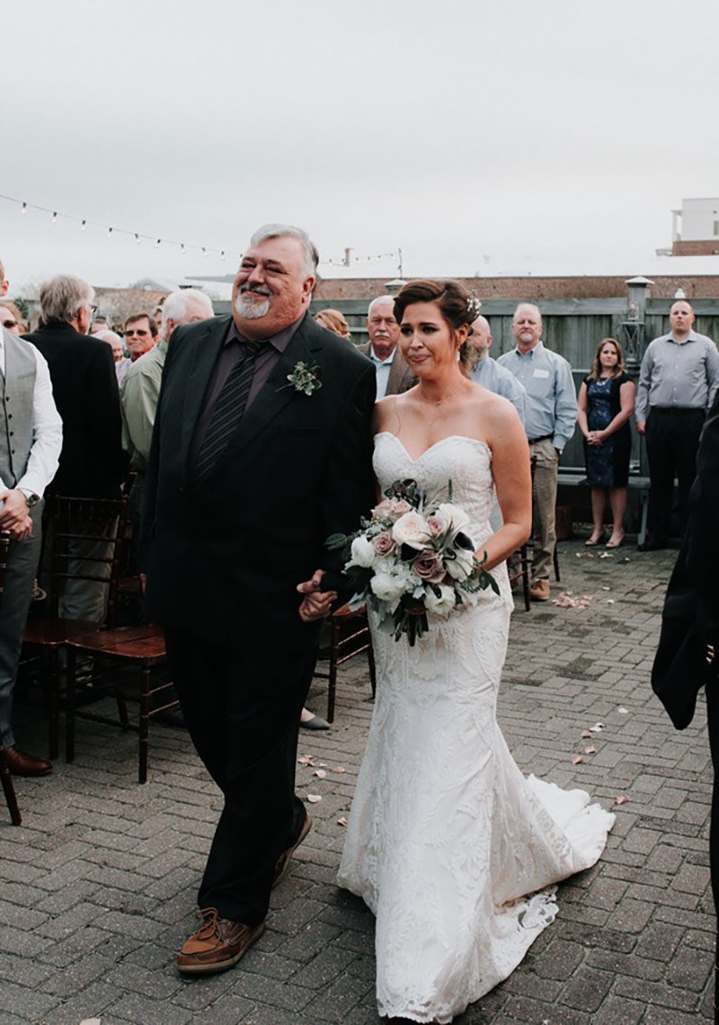 Pine cones, flowery hair, and forest chic combine at this rustic wedding