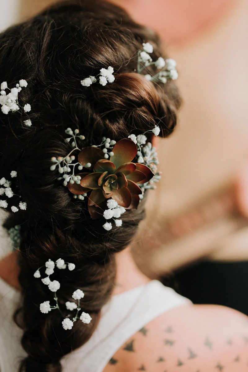 Pine cones, flowery hair, and forest chic combine at this rustic mountain wedding
