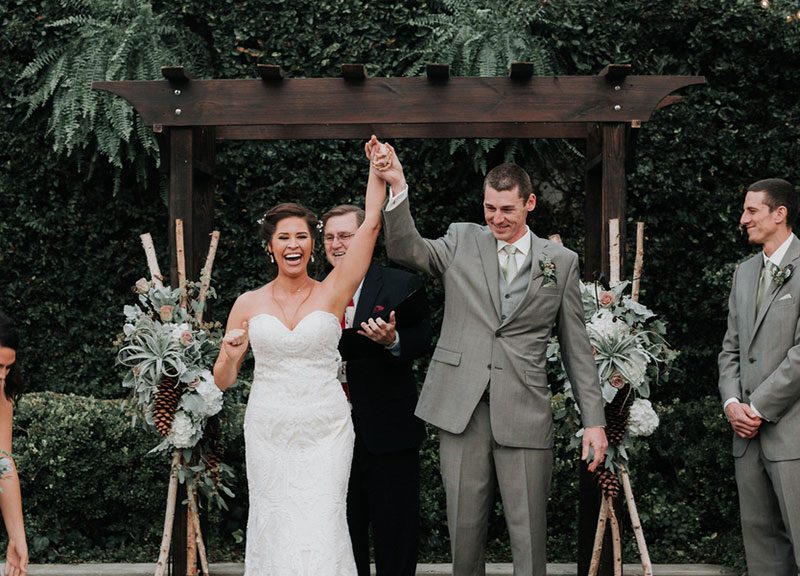 Pine cones, flowery hair, and forest chic combine at this rustic wedding