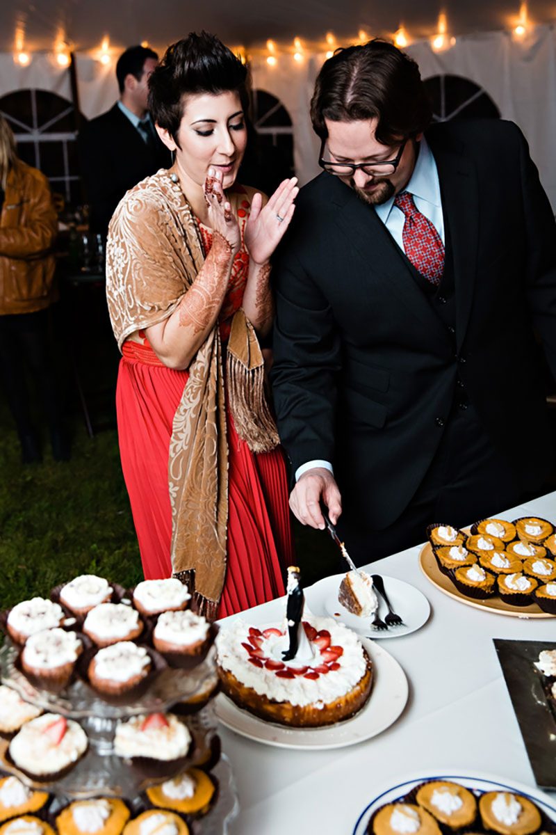 Intimate, rustic DIY fall wedding celebration with red-dressed bride