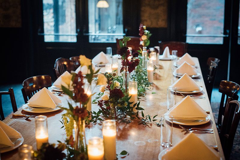 A glam Halloween wedding with a black dress and beignets