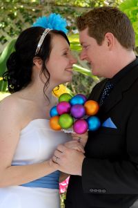 Check the christmas ornament wedding bouquet at this colorful, crafty, “hip-but-won’t-scare-grandma” gathering