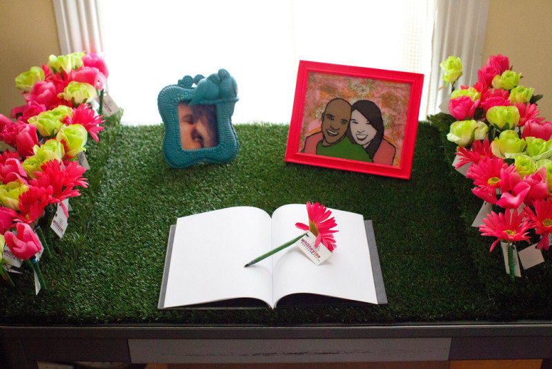 Kitschy DIY guestbook table with flower pen favors