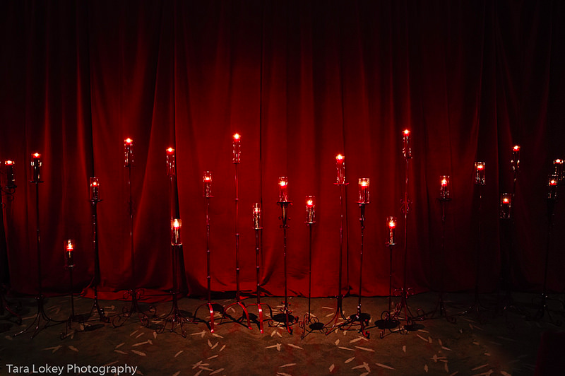 Dark and sexy red velvet wedding ceremony decor