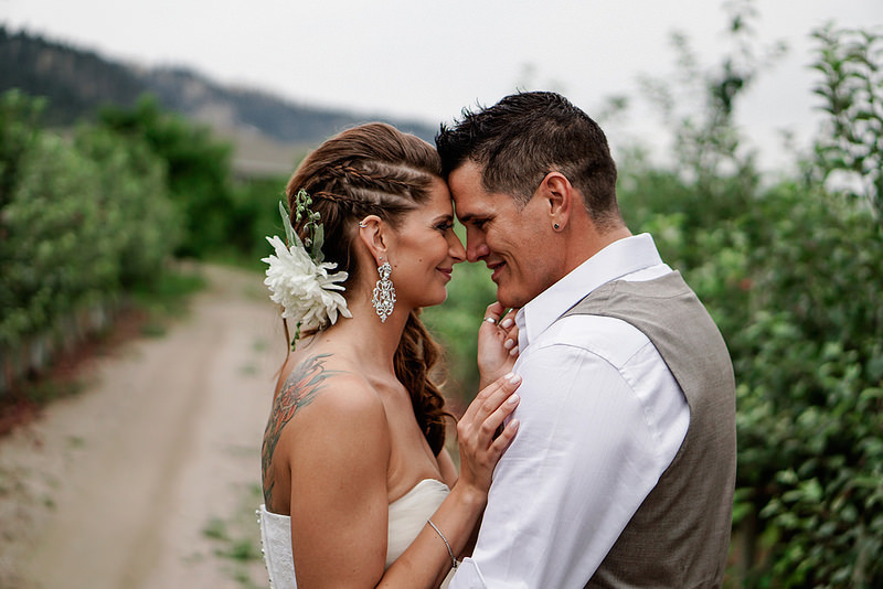 Hailey & Delainy’s outdoor wedding with an heirloom dress, log ceremony, and fake tattoos