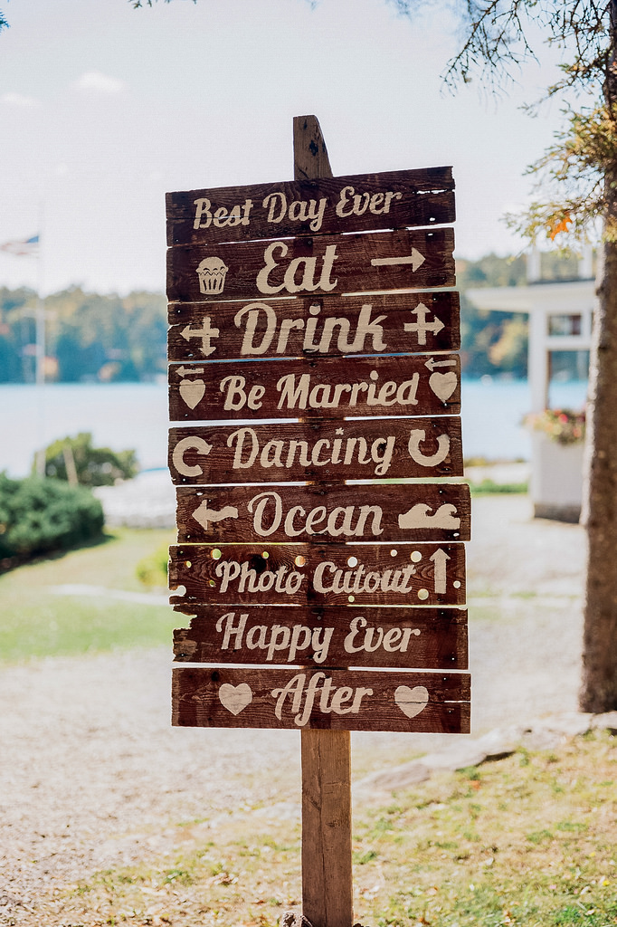 Dog ring bearers and a group walk down the aisle at Marcia & Zach’s Maine beach wedding