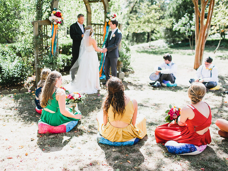 Up your wedding party seating game: seat them on pillows