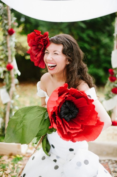 This huge red flowers + backyard wedding as seen on @offbeatbride #fascinator #hugeflowerbouquet