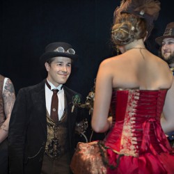 Simmons Sharp Photomuse SHA1502320665 low - The red dress at this theatrical steampunk wedding is LIFE Steampunk wedding as seen on @offbeatbride #steampunk #weddings
