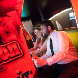50 Reception Rebecca and Greg Playing Arcade Games - Level up at this arcade adventure quest wedding Level up at this board games, arcade, quest wedding as seen on @offbeatbride