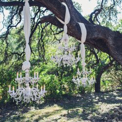 Scott Peabody Christina Carroll Photography favKimandJeremy0288copy low - Hanging chandeliers and cowboy boots at this Texas rock 'n' roll wedding Hanging chandelier wedding decor as seen on @offbeatbride