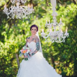 Scott Peabody Christina Carroll Photography favKimandJeremy2416copy low - Hanging chandeliers and cowboy boots at this Texas rock 'n' roll wedding Hanging chandelier wedding decor as seen on @offbeatbride