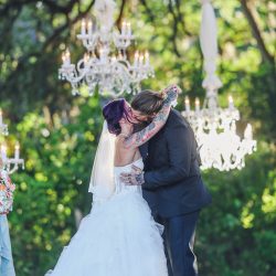 Scott Peabody Christina Carroll Photography favKimandJeremy2704 low - Hanging chandeliers and cowboy boots at this Texas rock 'n' roll wedding Hanging chandelier wedding decor as seen on @offbeatbride