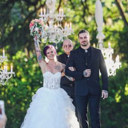 Scott Peabody Christina Carroll Photography favKimandJeremy2721copy low - Hanging chandeliers and cowboy boots at this Texas rock 'n' roll wedding Hanging chandelier wedding decor as seen on @offbeatbride