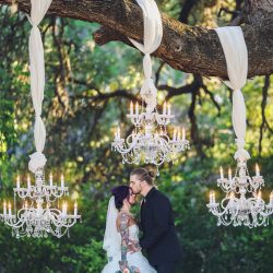 Scott Peabody Christina Carroll Photography favKimandJeremy2795copy low - Hanging chandeliers and cowboy boots at this Texas rock 'n' roll wedding Hanging chandelier wedding decor as seen on @offbeatbride
