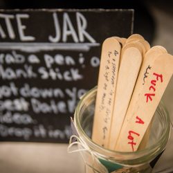 OBB1 0027 - A steampunk circus wedding with corsets, ringleaders, and the best flower girl you'll see today Date night jar guest book wedding idea as seen on @offbeatbride