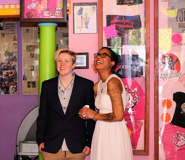 Ring Pops, donuts, and ladies in love at this Voodoo Donuts wedding