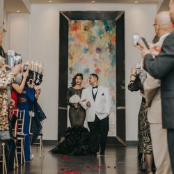 An art gallery wedding with the black wedding gown of our dreams