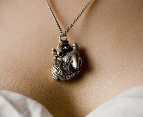 Someone needs to wear this goth-glam anatomical heart necklace at their wedding