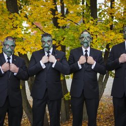 A gas mask-erade wedding fit for the impending zombie apocalypse