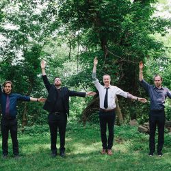 A Muppet officiated this cliffside New York wedding with a killer black dress
