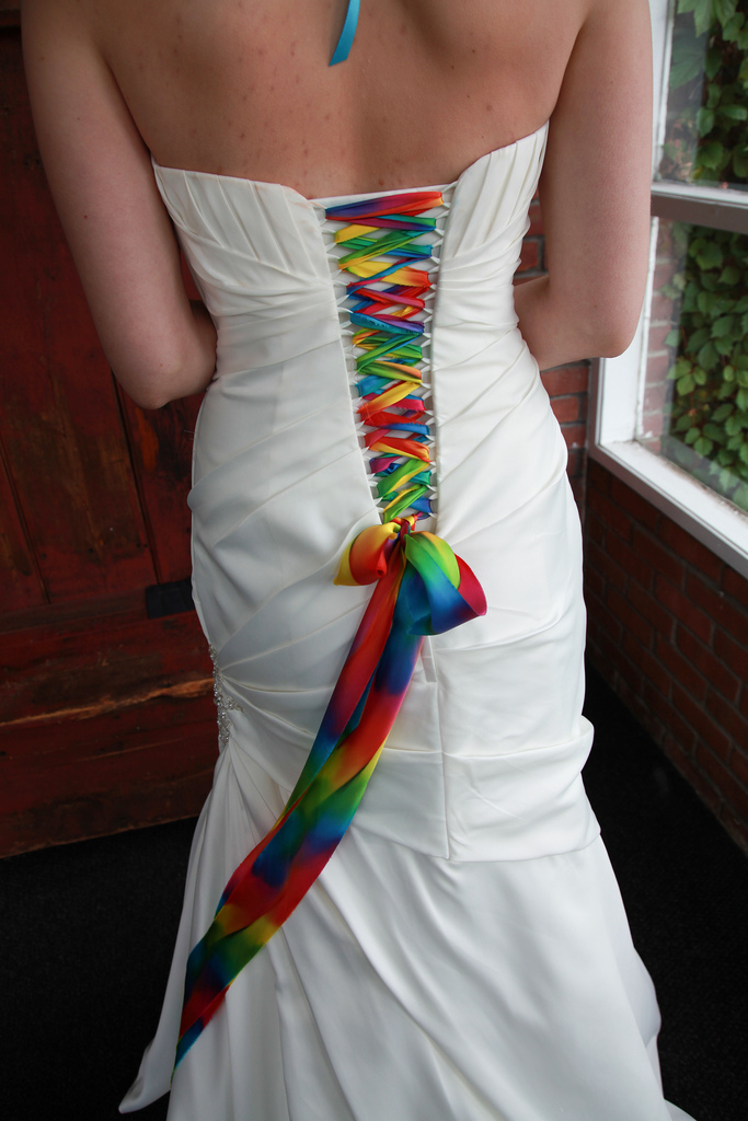 Lace up your white wedding gown with a rainbow ribbon