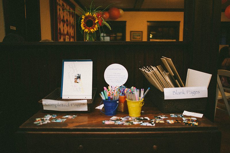 Ask your guests to get artsy on loose scrapbook pages for your guest book
