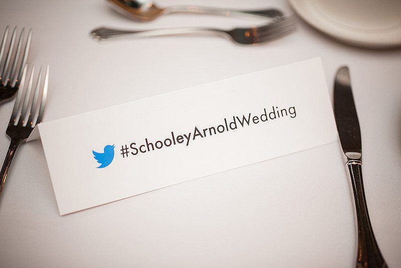 Put your wedding’s hashtag on the back of your place cards