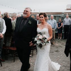 Pine cones, flowery hair, and forest chic combine at this rustic wedding