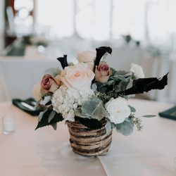 Pine cones, flowery hair, and forest chic combine at this rustic wedding