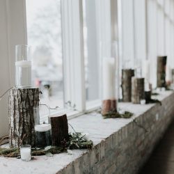 Pine cones, flowery hair, and forest chic combine at this rustic wedding