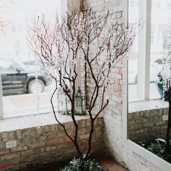 Pine cones, flowery hair, and forest chic combine at this rustic wedding