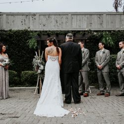 Pine cones, flowery hair, and forest chic combine at this rustic wedding