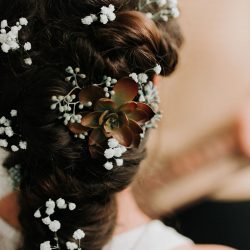 Pine cones, flowery hair, and forest chic combine at this rustic mountain wedding