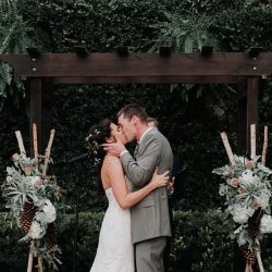 Pine cones, flowery hair, and forest chic combine at this rustic wedding